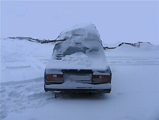 Последствия сильнейшего снегопада на Сахалине (17 фотографий)